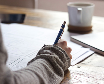 Woman writing in notebook