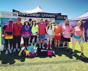 a group of people wearing costumes participating in Relay For Life West Coast