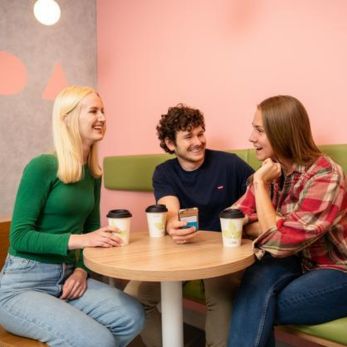 Students chatting over coffee