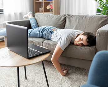 Young woman asleep on the couch