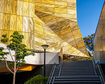 The golden facade of ECU's Communications Centre shimmers in the sunlight