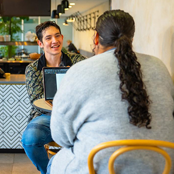 Student and mentor catch up over coffee