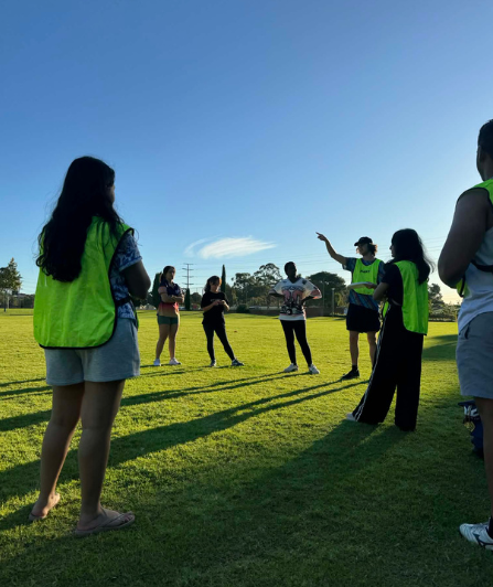 Students playing ultimate frisbee at a sports session. 